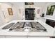 Stylish kitchen with a center island cooktop, black refrigerator and dishwasher, offering the best in cooking at 1 Crooked Bridge Way, Ormond Beach, FL 32174