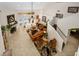 Open-concept living room with natural light, fireplace, and elegant staircase at 1 Crooked Bridge Way, Ormond Beach, FL 32174