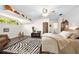 Spacious bedroom featuring a zebra rug, wooden floors and decor, with an open doorway for easy access at 1 Crooked Bridge Way, Ormond Beach, FL 32174