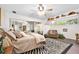 Comfortable bedroom with large window and mirrored closet doors at 1 Crooked Bridge Way, Ormond Beach, FL 32174