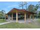 Community pavilion with picnic tables and a mural, offering a gathering space at 1 Crooked Bridge Way, Ormond Beach, FL 32174