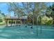 Community playground features swings, a picnic area, and lush landscaping in a Gathering-friendly environment at 1 Crooked Bridge Way, Ormond Beach, FL 32174