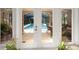 View of screened-in pool from french doors at 1 Crooked Bridge Way, Ormond Beach, FL 32174