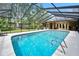 Relaxing screened-in pool with clear blue water and a spacious deck area perfect for lounging and entertaining at 1 Crooked Bridge Way, Ormond Beach, FL 32174