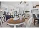 Open concept living room featuring hard wood floors and views to dining room and entryway at 11616 Sw 75Th Cir, Ocala, FL 34476