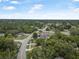 Overhead view of the community featuring mature trees, single-Gathering homes, and winding streets at 1333 E Lombardy Dr, Deltona, FL 32725