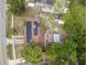 Bird's-eye view of a home with solar panels, a detached garage, and a spacious backyard at 1333 E Lombardy Dr, Deltona, FL 32725