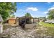 Backyard featuring a shed, ATV storage and a grassy area for outdoor activities at 1333 E Lombardy Dr, Deltona, FL 32725
