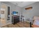 Bedroom featuring a desk, a TV, and a bed at 1333 E Lombardy Dr, Deltona, FL 32725