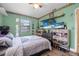 Spacious bedroom featuring a queen bed and laminate flooring at 1333 E Lombardy Dr, Deltona, FL 32725