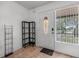 Bright foyer featuring decorative tile flooring and a secure front entrance with an oval window at 1333 E Lombardy Dr, Deltona, FL 32725