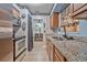 Well-equipped kitchen featuring stainless steel appliances and stylish granite countertops at 1333 E Lombardy Dr, Deltona, FL 32725