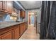 Functional kitchen with stainless steel appliances and granite countertops at 1333 E Lombardy Dr, Deltona, FL 32725