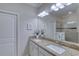 Bathroom with granite countertops, dual sinks, a glass shower, and white cabinetry at 206 St Somewhere Dr, Daytona Beach, FL 32124