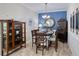 Elegant dining room featuring a classic table setting, complemented by traditional furnishings and a refined chandelier at 206 St Somewhere Dr, Daytona Beach, FL 32124