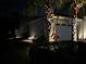 Exterior view of the home at night, showcasing manicured landscaping at 206 St Somewhere Dr, Daytona Beach, FL 32124