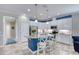 Modern kitchen with white cabinets, stainless steel appliances, granite counters, and a breakfast bar with stylish seating at 206 St Somewhere Dr, Daytona Beach, FL 32124