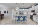 Open-concept kitchen with granite countertops, stainless steel appliances, and a center island with seating for casual dining at 206 St Somewhere Dr, Daytona Beach, FL 32124