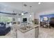 Kitchen island featuring granite countertops, stainless steel appliances, and open floor plan concept at 206 St Somewhere Dr, Daytona Beach, FL 32124
