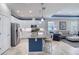 Bright, open kitchen with granite island and modern appliances, seamlessly connected to the living area for easy entertaining at 206 St Somewhere Dr, Daytona Beach, FL 32124