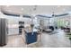Bright, open kitchen with granite countertops, stainless steel appliances, and seamless flow to living area at 206 St Somewhere Dr, Daytona Beach, FL 32124