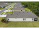 An aerial view that shows the home's expansive roof and proximity to a nearby neighborhood pool at 2861 Monaghan Dr, Ormond Beach, FL 32174