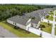 This aerial shot highlights the home's manicured lawn, landscaping, and proximity to neighborhood pool at 2861 Monaghan Dr, Ormond Beach, FL 32174