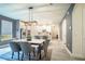 Dining room features a modern light fixture and an elegant table creating an ideal space for gatherings at 2861 Monaghan Dr, Ormond Beach, FL 32174