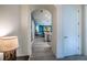 Hallway view highlighting open floor plan, archways, and neutral tones creating a seamless flow throughout the home at 2861 Monaghan Dr, Ormond Beach, FL 32174
