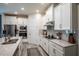 Bright kitchen featuring granite countertops, stainless steel appliances, and ample storage space for the modern home at 2861 Monaghan Dr, Ormond Beach, FL 32174