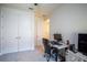 Office space with work desk, plush carpet and large closet doors for storage at 2861 Monaghan Dr, Ormond Beach, FL 32174