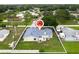 Drone image of the house with a big backyard in a quiet neighborhood, outlined in white at 2910 Yule Tree Dr, Edgewater, FL 32141