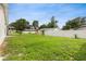Large fenced-in backyard featuring a spacious lawn, providing privacy and room for recreation at 2910 Yule Tree Dr, Edgewater, FL 32141