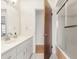 Bathroom featuring a double sink vanity and a step-in shower with glass door at 2910 Yule Tree Dr, Edgewater, FL 32141
