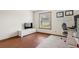 Sunlit bedroom with hardwood floors, large window, tv and spacious desk area at 2910 Yule Tree Dr, Edgewater, FL 32141