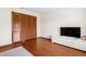 Bedroom featuring hardwood floors, a large closet and media center at 2910 Yule Tree Dr, Edgewater, FL 32141