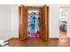 Open closet with wood doors, shelving and storage at 2910 Yule Tree Dr, Edgewater, FL 32141