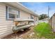Home exterior featuring a rack for kayaks and lush green grass at 2910 Yule Tree Dr, Edgewater, FL 32141