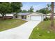 Charming single Gathering home with a spacious driveway and two car garage at 2910 Yule Tree Dr, Edgewater, FL 32141