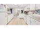 Well-lit kitchen features modern appliances, white cabinetry, and tile backsplash at 2910 Yule Tree Dr, Edgewater, FL 32141