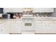 A clean, organized kitchen with white cabinets and appliances at 2910 Yule Tree Dr, Edgewater, FL 32141