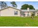 This patio features an outdoor grill, perfect for cooking and entertaining in the spacious backyard at 2910 Yule Tree Dr, Edgewater, FL 32141