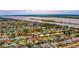 Wide aerial shot shows a charming residential neighborhood near a beautiful waterway at 33 Camellia Dr, Ormond Beach, FL 32176