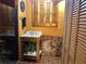 Charming bathroom featuring a unique wood vanity, shuttered windows, and a glass-enclosed shower at 33 Camellia Dr, Ormond Beach, FL 32176