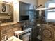 Beautiful bathroom featuring decorative stone, glass shower, and custom vanity with ample storage at 33 Camellia Dr, Ormond Beach, FL 32176