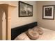 Comfortable bedroom with a statement column, stylish artwork, and cozy bedding at 33 Camellia Dr, Ormond Beach, FL 32176