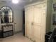 Comfortable bedroom with built-in murphy bed, large mirror, and plenty of storage space at 33 Camellia Dr, Ormond Beach, FL 32176
