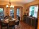 Dining room with outdoor access, unique lighting, and ample space for gatherings or entertaining at 33 Camellia Dr, Ormond Beach, FL 32176