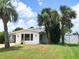 Beautifully landscaped yard surrounding a well-maintained home with a view at 33 Camellia Dr, Ormond Beach, FL 32176
