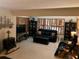 Cozy living room featuring comfortable seating, fireplace, and plenty of natural light at 33 Camellia Dr, Ormond Beach, FL 32176
